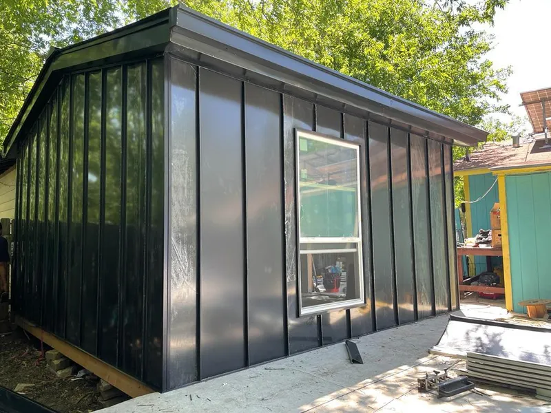 Black standing seam metal wall panels for Metal Roof Installation in Fort Lewis